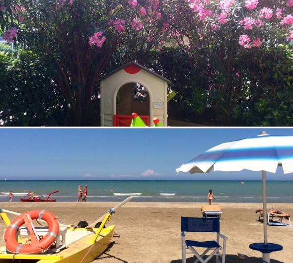 Giardino fiorito e spiaggia soleggiata con mare calmo e ombrelloni.